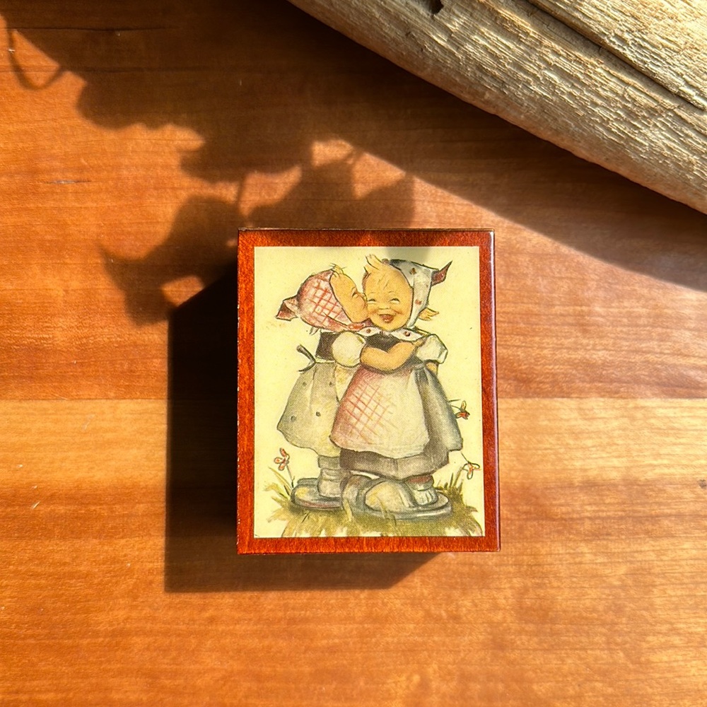 Vintage Hummel small music box w/two little girls laughing/plays Love Story.
